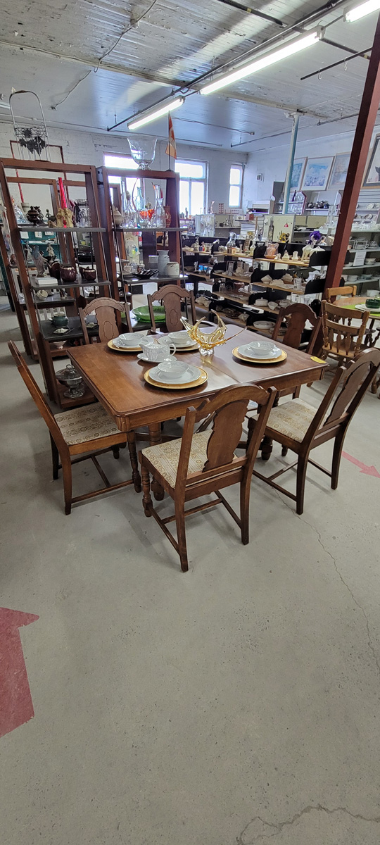 A neatly set dining table display in the store