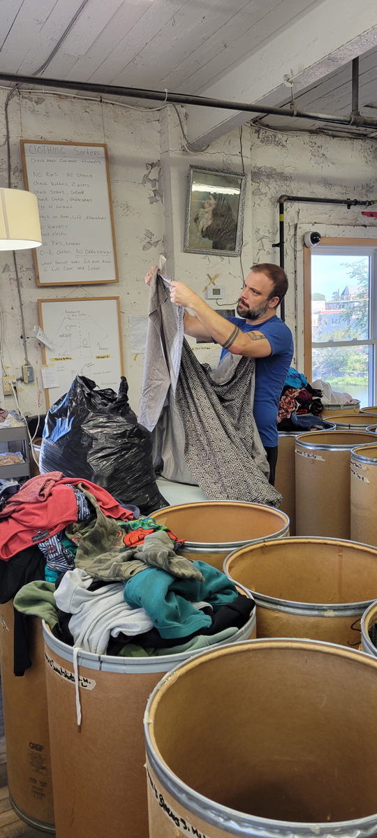 Bins of donated items waiting to be sorted